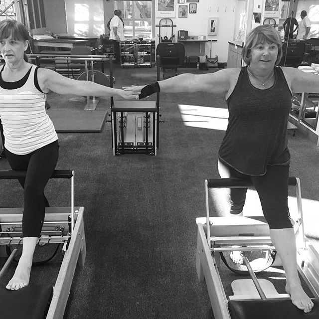 Practicing balance with these goddesses‍️‍! We used one red spring. Stand in front of your reformer with one foot on the carriage. As you push the carriage away, lift onto the ball of your foot on your standing leg.  Whoa - spread your wings (arms) to help stabilize.  Go for it! #reformer #balance #stability #stabilize #goddess #pilates #pilatesgoddess #basi #basipilates #gracefulpilates